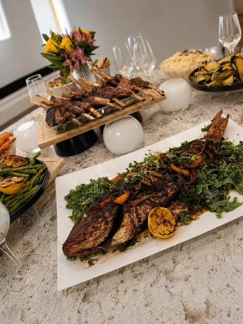 Whole fish and lamb table spread